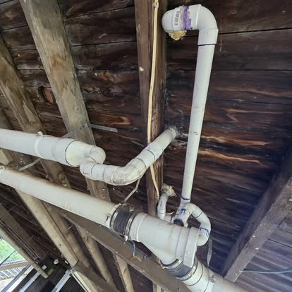 Underfloor plumbing and timber structure during renovation